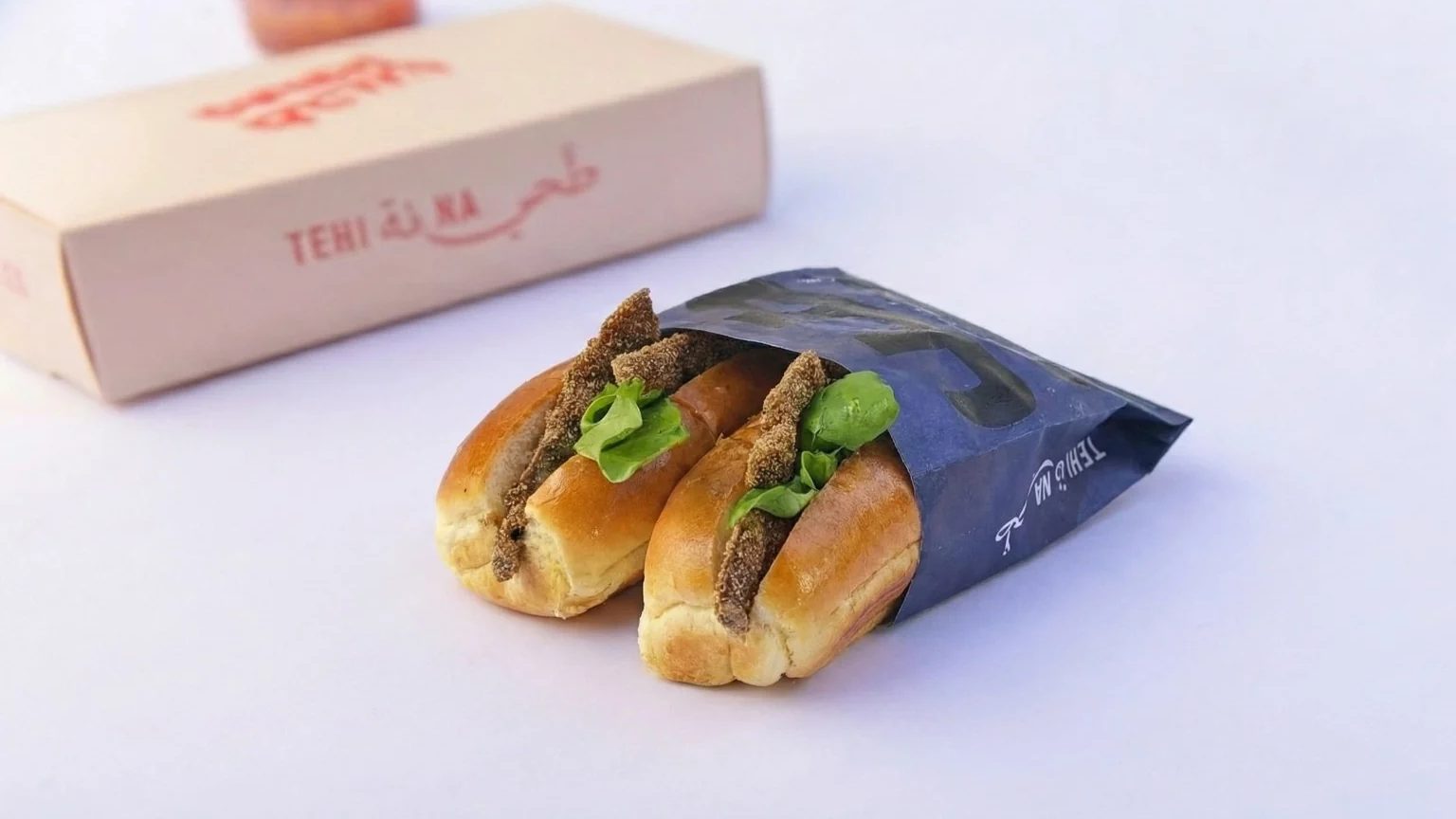 Two Tehina sandwiches in branded packaging